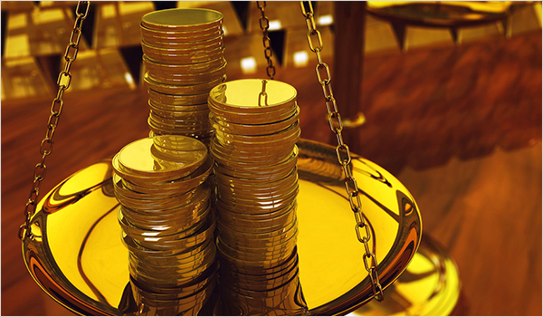 Gold coins on weighing scale